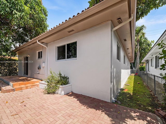 rear view of house featuring a patio