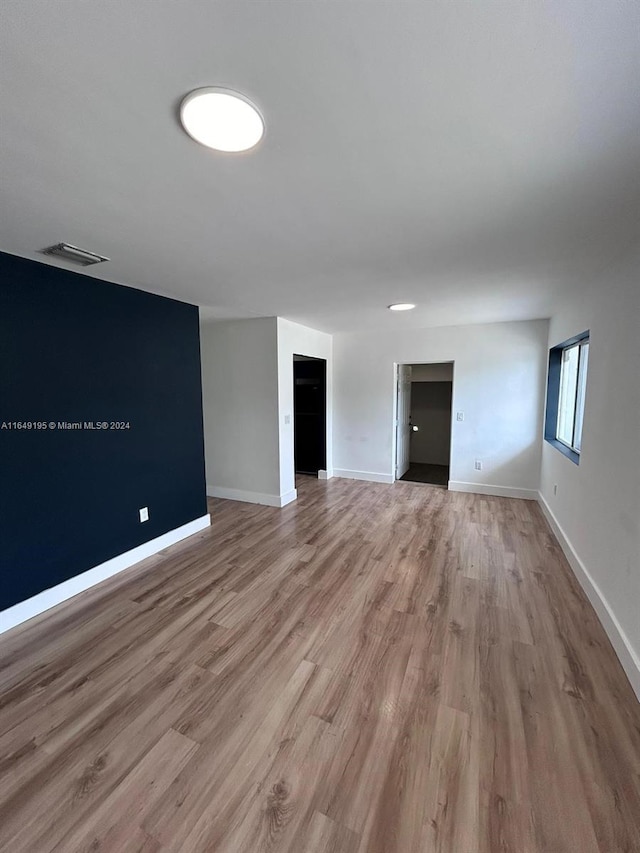 unfurnished living room featuring light wood-type flooring