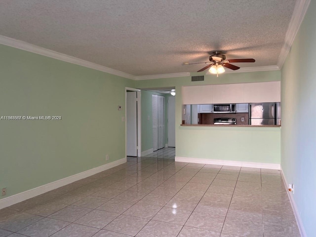 interior space featuring ornamental molding, a textured ceiling, light tile patterned floors, and ceiling fan