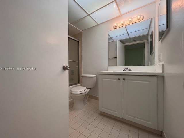 full bathroom with tile patterned flooring, vanity, toilet, and shower / bath combination with glass door