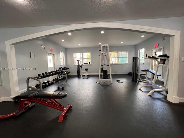 workout area with a textured ceiling