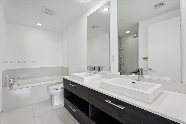 full bathroom with tile patterned flooring, vanity, toilet, and plus walk in shower