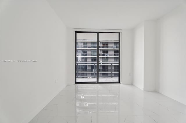 tiled empty room with expansive windows