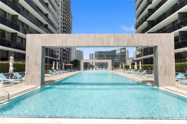 view of swimming pool featuring pool water feature