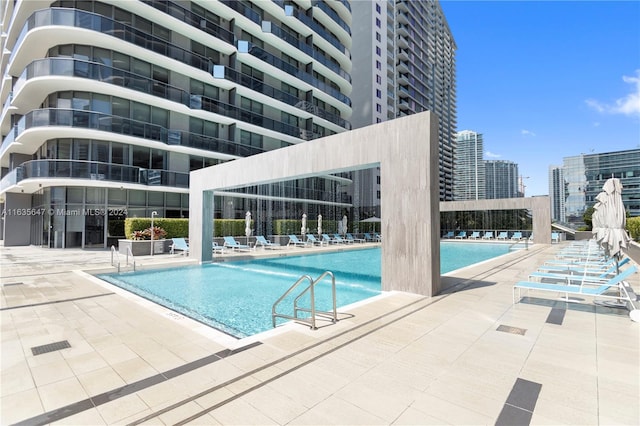 view of swimming pool with a patio area