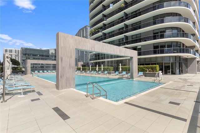 view of swimming pool with a patio