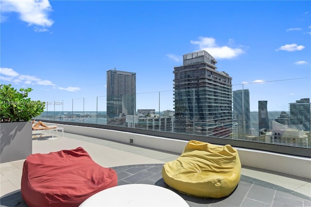 view of patio featuring a balcony