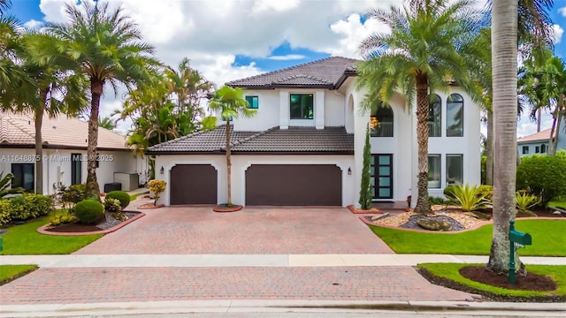 mediterranean / spanish house featuring a garage