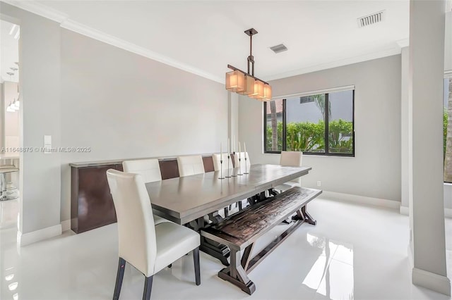 dining room featuring crown molding