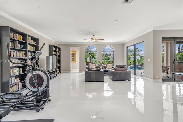 interior space featuring plenty of natural light, ceiling fan, and crown molding