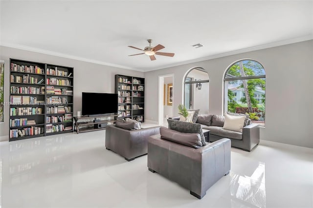 living room with ceiling fan and ornamental molding