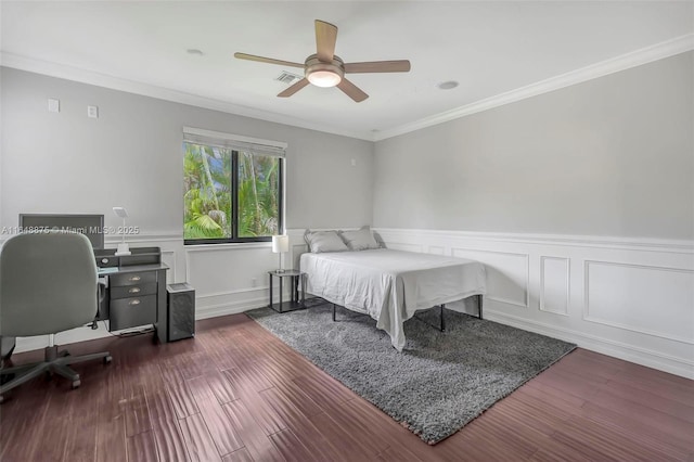 bedroom with ceiling fan, crown molding, and dark hardwood / wood-style floors