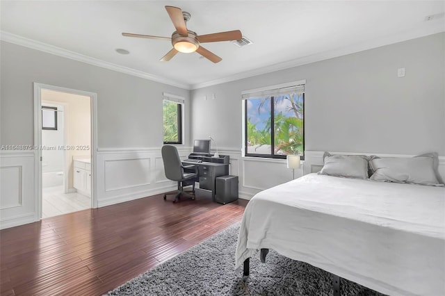 bedroom featuring ensuite bath, light hardwood / wood-style flooring, ceiling fan, and ornamental molding