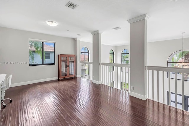 spare room featuring dark hardwood / wood-style flooring