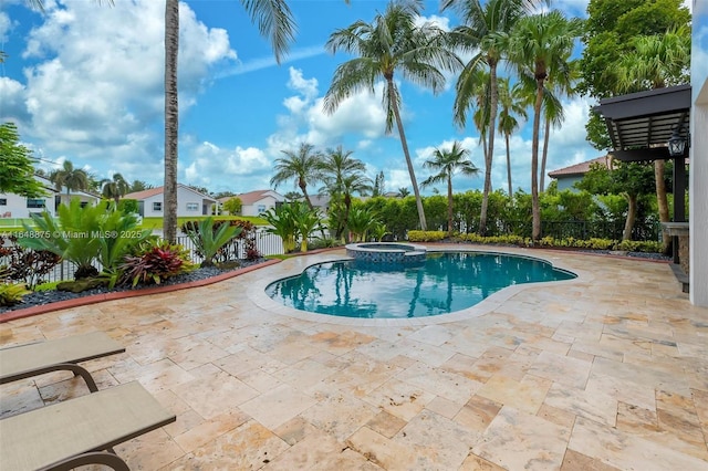 view of swimming pool with an in ground hot tub and a patio