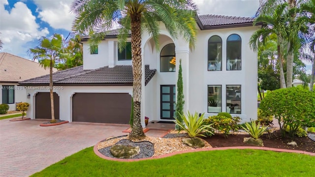 mediterranean / spanish-style house featuring a garage