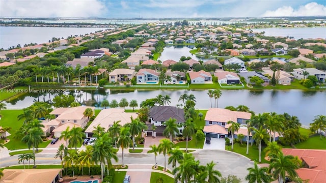 drone / aerial view with a water view