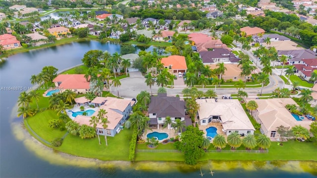 birds eye view of property with a water view