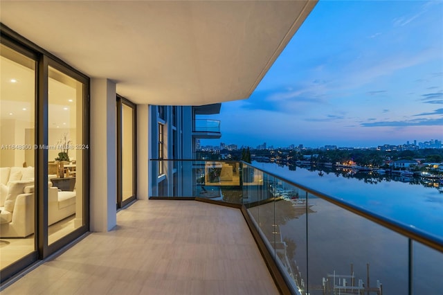 balcony at dusk with a water view