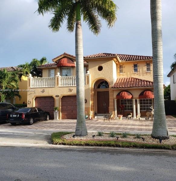 mediterranean / spanish-style home with a balcony