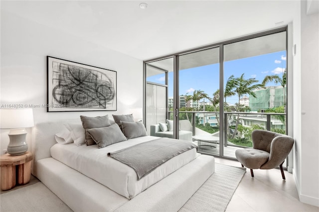 bedroom featuring floor to ceiling windows and access to outside