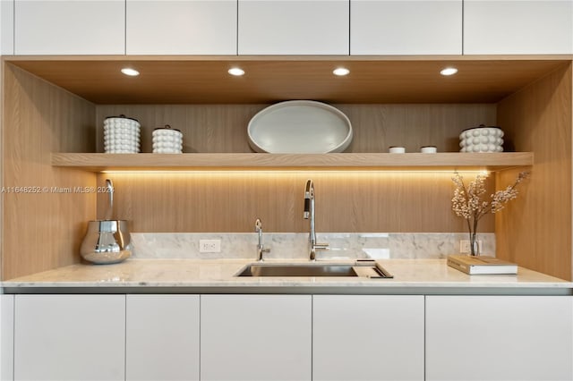 interior space featuring vanity and backsplash