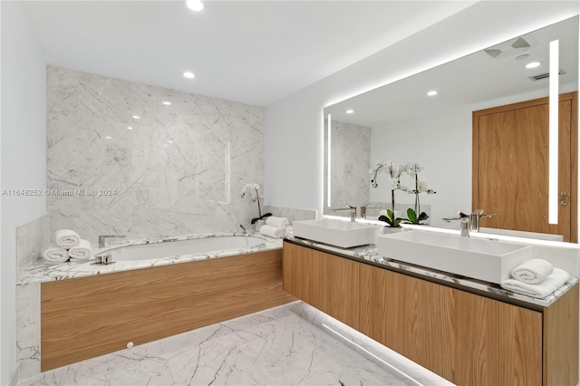 bathroom with vanity and a bathtub