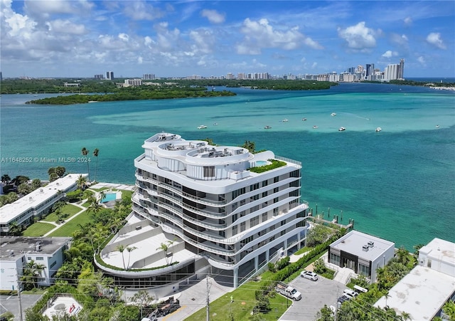 birds eye view of property with a water view