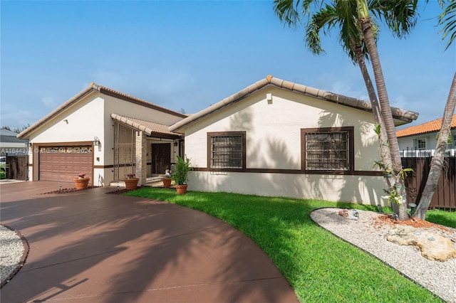 mediterranean / spanish-style home featuring a garage