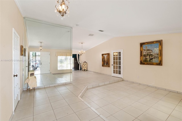 interior space with a notable chandelier, french doors, lofted ceiling, and ornamental molding