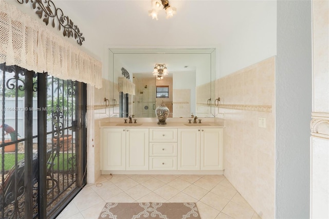 bathroom featuring tile patterned floors, vanity, and tile walls