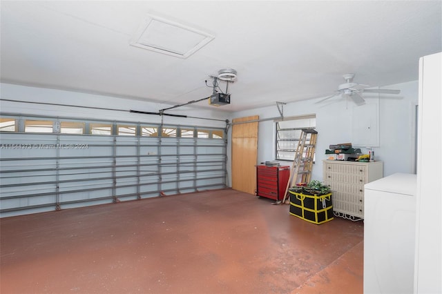 garage featuring washer / clothes dryer, a garage door opener, and ceiling fan