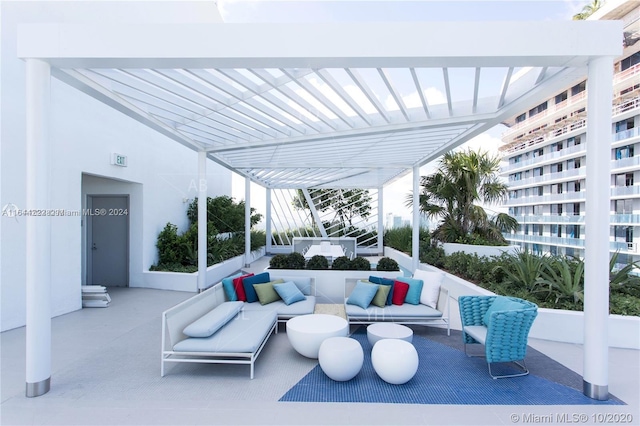 view of patio with a balcony and an outdoor hangout area