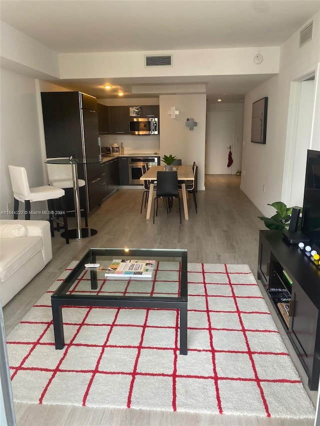 living room with light hardwood / wood-style flooring