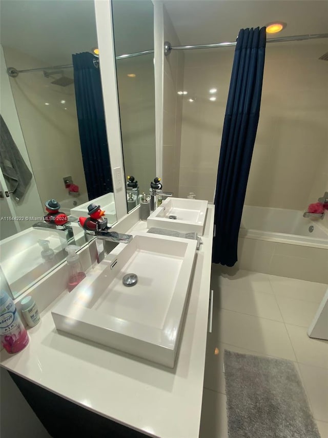 bathroom featuring shower / bath combo, tile patterned flooring, and vanity