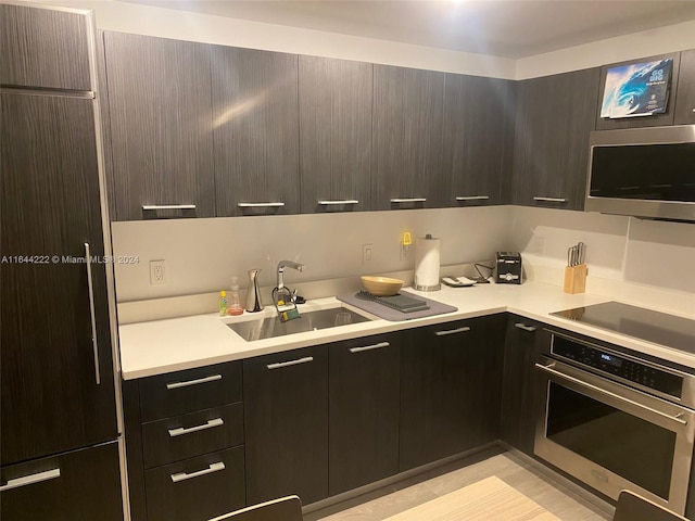 kitchen with appliances with stainless steel finishes and sink