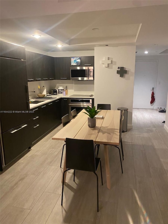 kitchen featuring stainless steel appliances and light hardwood / wood-style floors