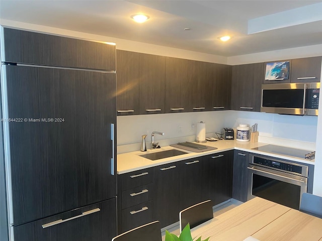 kitchen with appliances with stainless steel finishes and sink