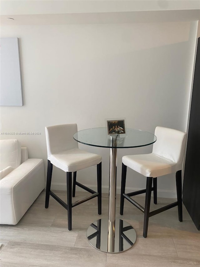 dining area with light hardwood / wood-style floors