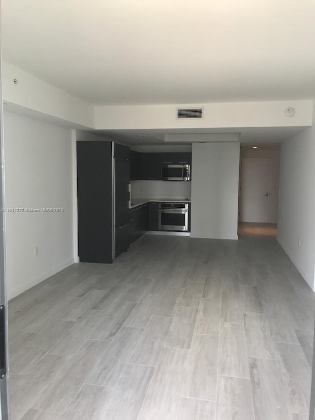 unfurnished living room with light hardwood / wood-style flooring