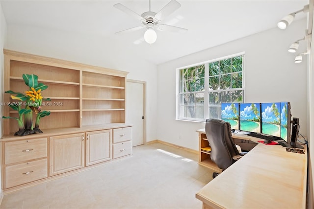 tiled office featuring vaulted ceiling and ceiling fan