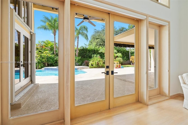 entryway featuring wood-type flooring, ceiling fan, and french doors