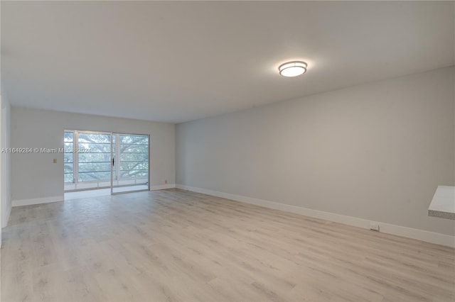 spare room featuring light hardwood / wood-style floors