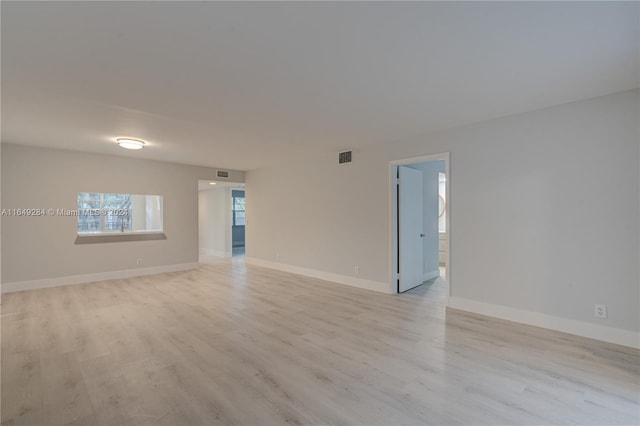 unfurnished room with light hardwood / wood-style flooring