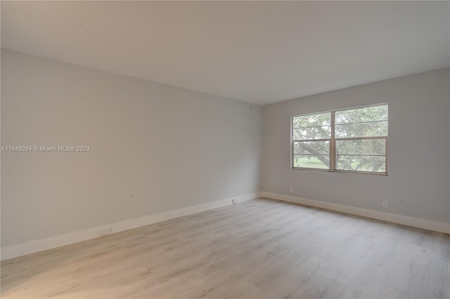 spare room featuring light hardwood / wood-style flooring