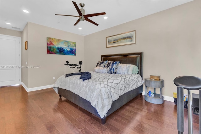 bedroom featuring ceiling fan and dark hardwood / wood-style flooring