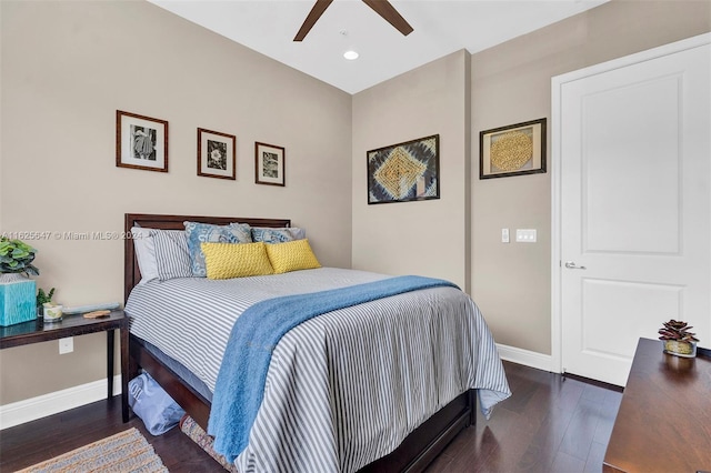 bedroom featuring ceiling fan and dark hardwood / wood-style floors