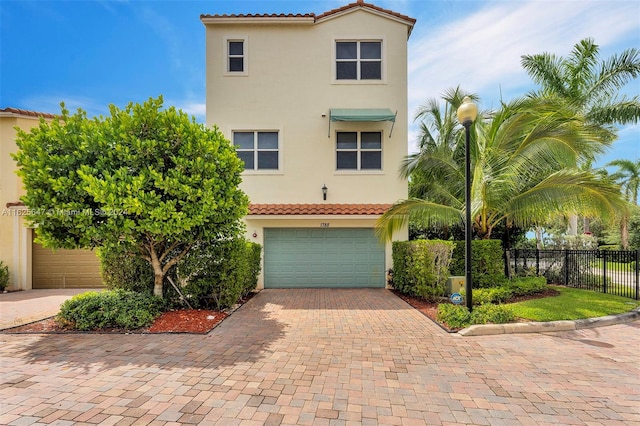 mediterranean / spanish-style house featuring a garage