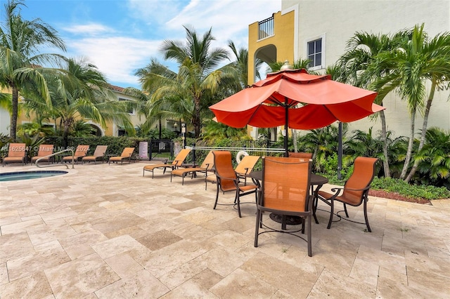 view of patio / terrace featuring a swimming pool