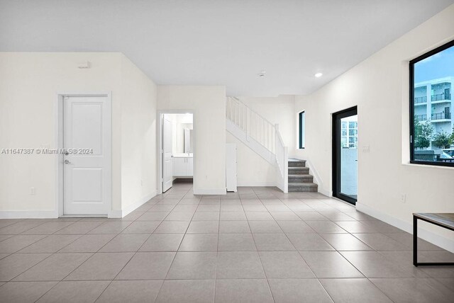 empty room with light tile patterned flooring